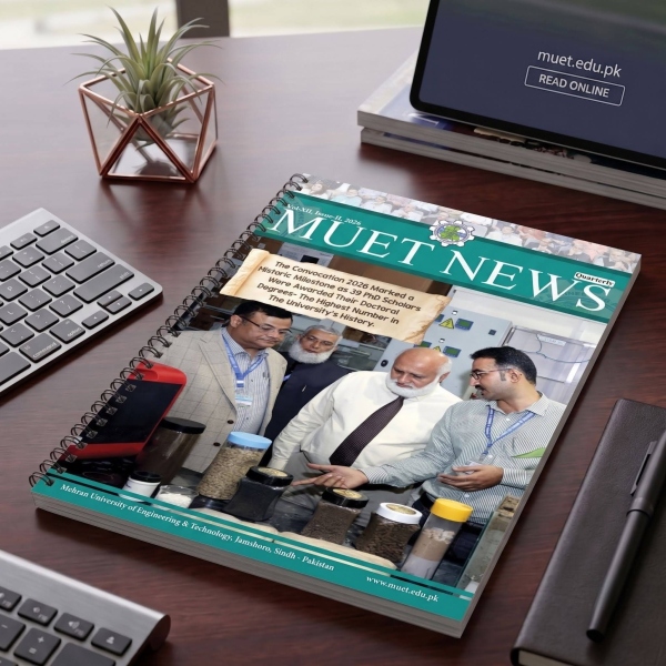 MUET Newsletter on a desk